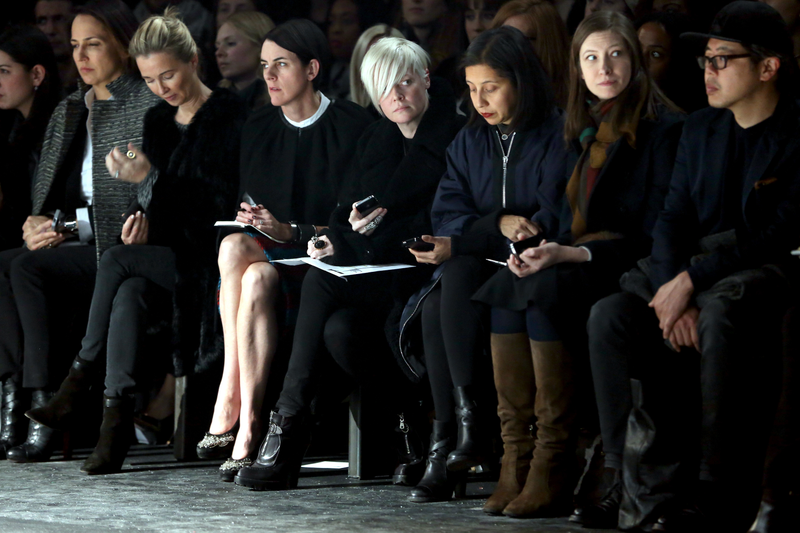 Kate Lanphear, center, at Fashion Week in 2014. Image via Getty